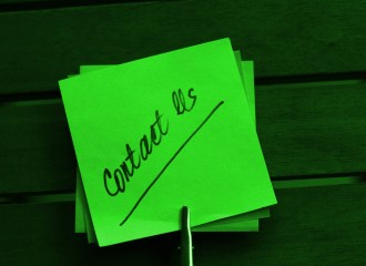 Contact us written on a postit note